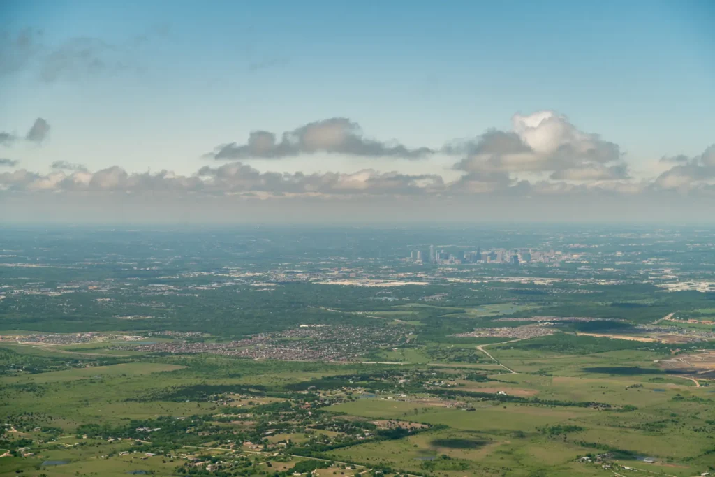 Aerial view of Austin, Texas skyline with surrounding land