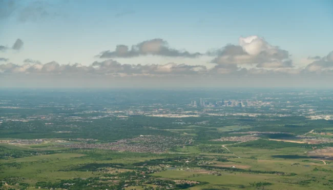 Aerial view of Austin, Texas skyline with surrounding land